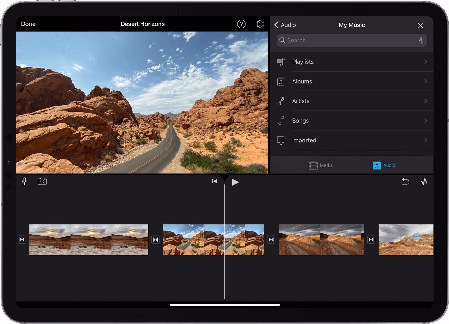 How do I add theme music to a video in iMovie?