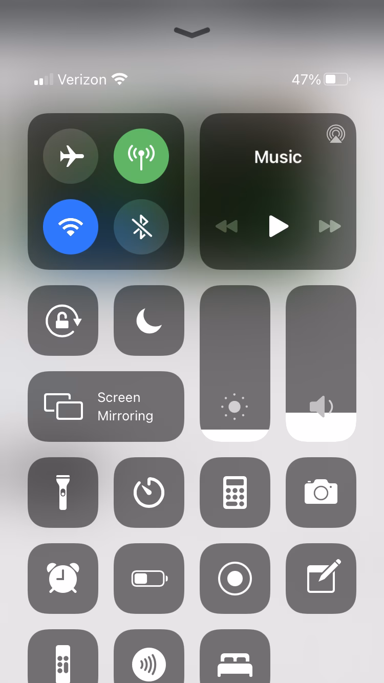 How do I fix the alarm clock icon on my iPhone?