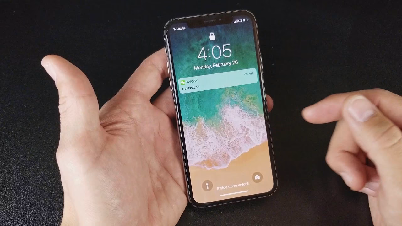 How do I use the flashlight on my iPhone?