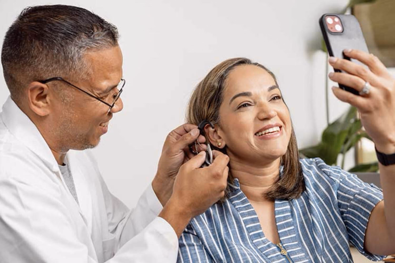 Why is it difficult to make mobile phones HAC?