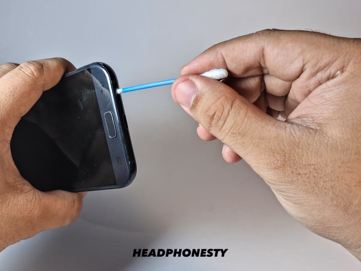 How do you clean a headphone jack if you have braces?