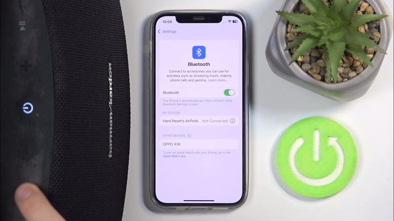 How do I sync two Harman Kardon speakers together?