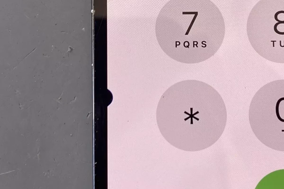 How do I get rid of black spots on my iPhone screen?