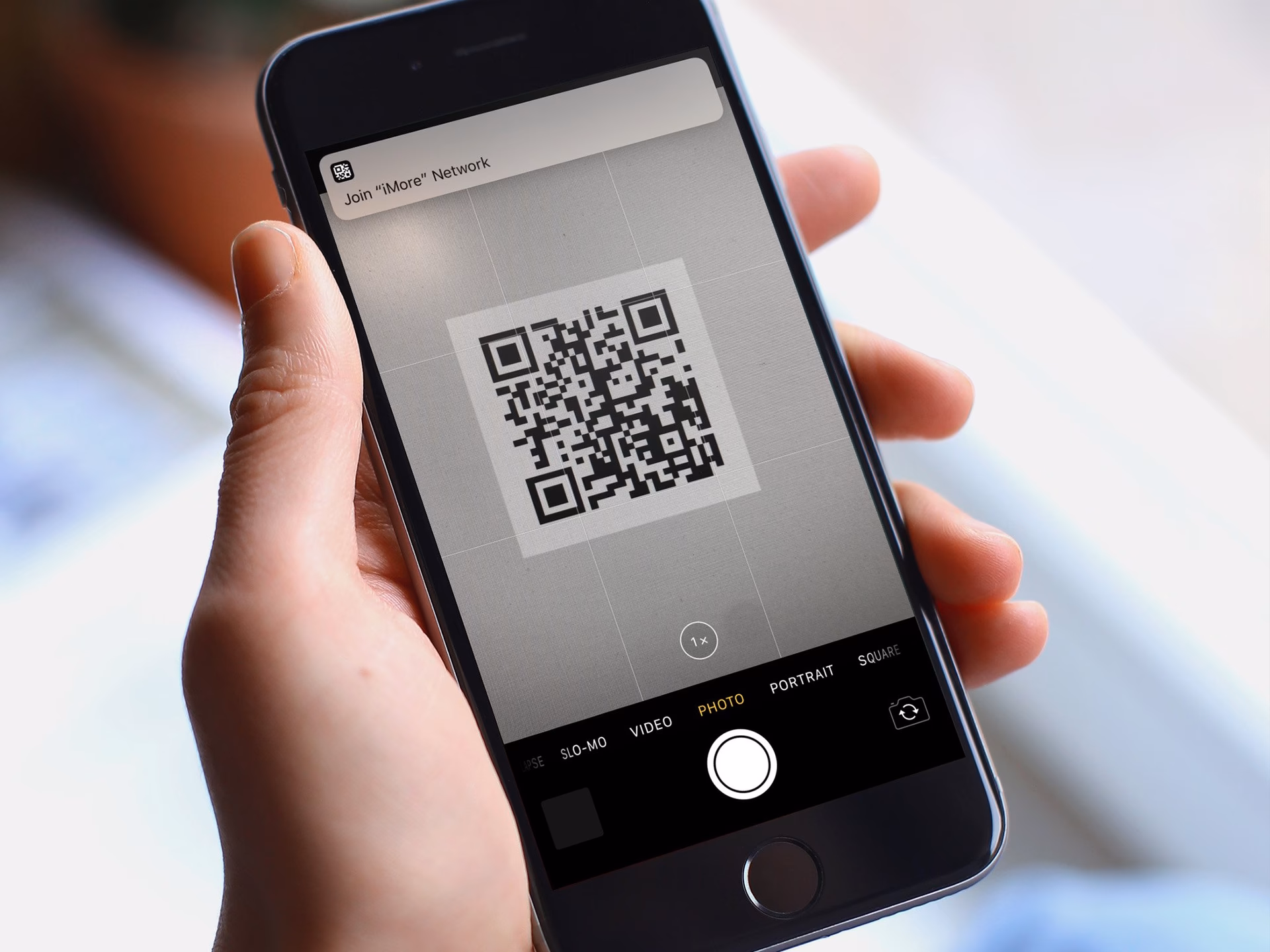 How do I save a QR code on my iPhone?
