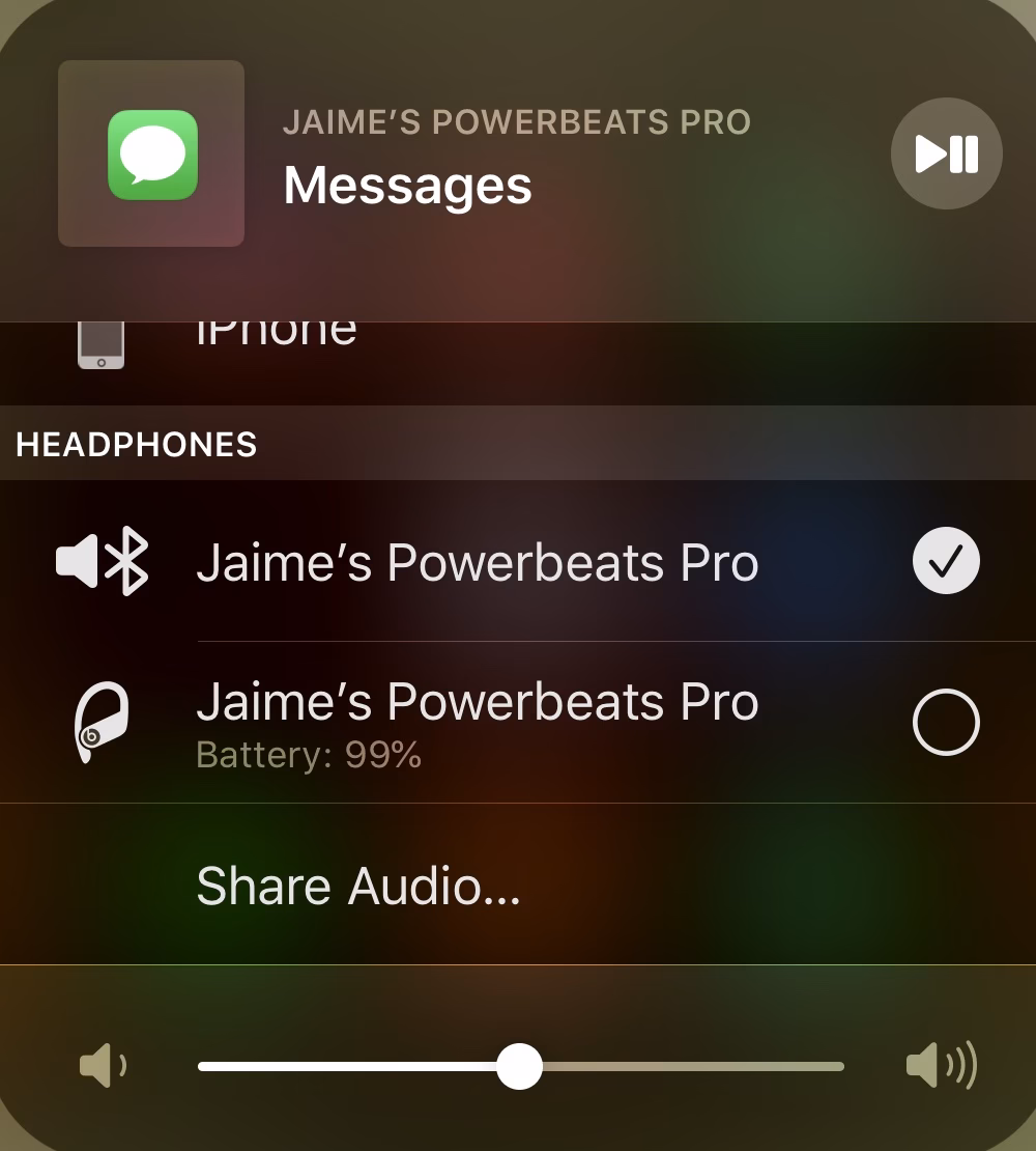 How do I adjust the volume on my iPhone?