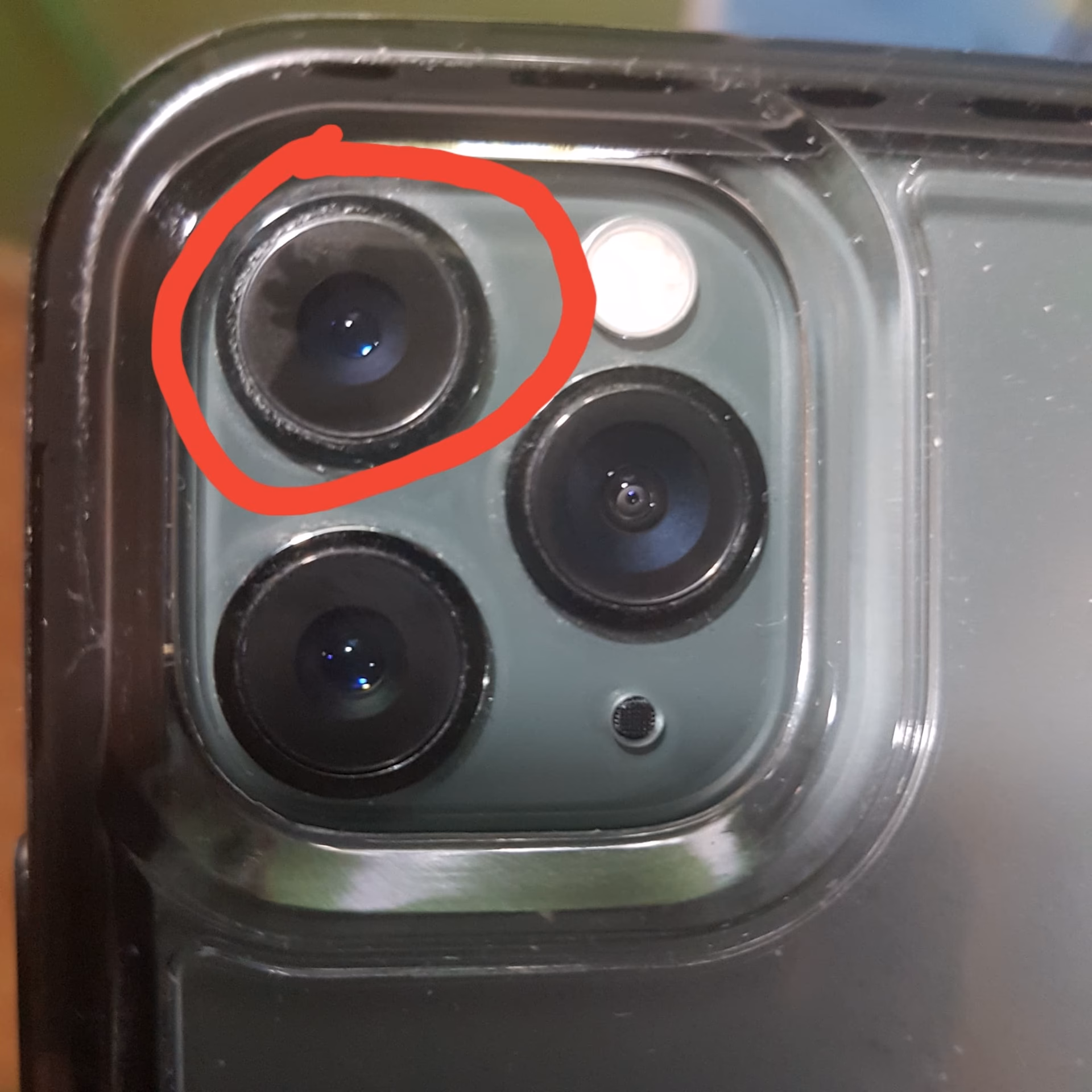 Why is my iPhone camera lens scratching?