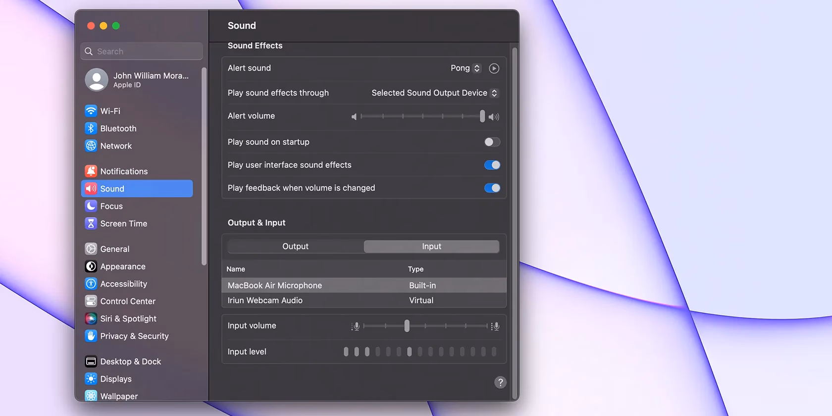 How do I use the iPhone's built-in microphone instead of the headset?