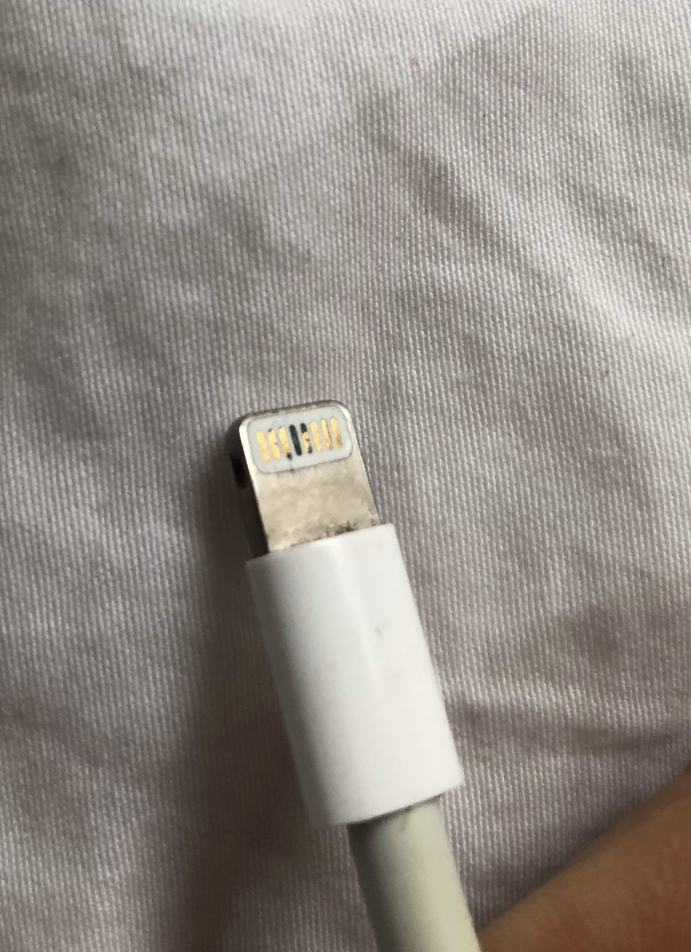 Can a defective charging cable damage an iPhone?