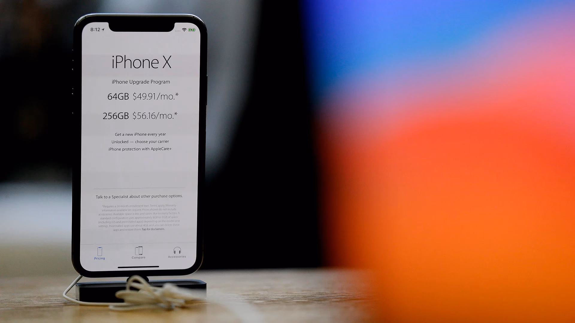 How do I call emergency services on my iPhone?